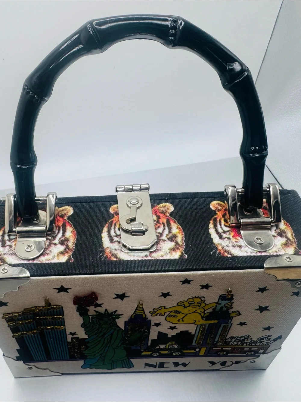 Unique bamboo handle clutch.